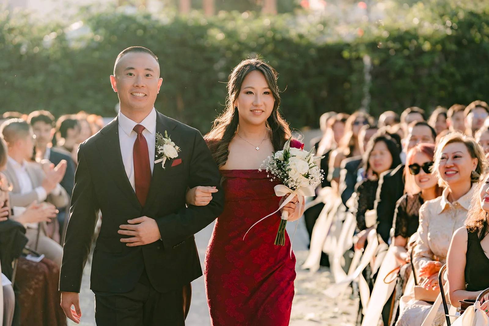 Bridesmaid and groomsman walking down the aisle