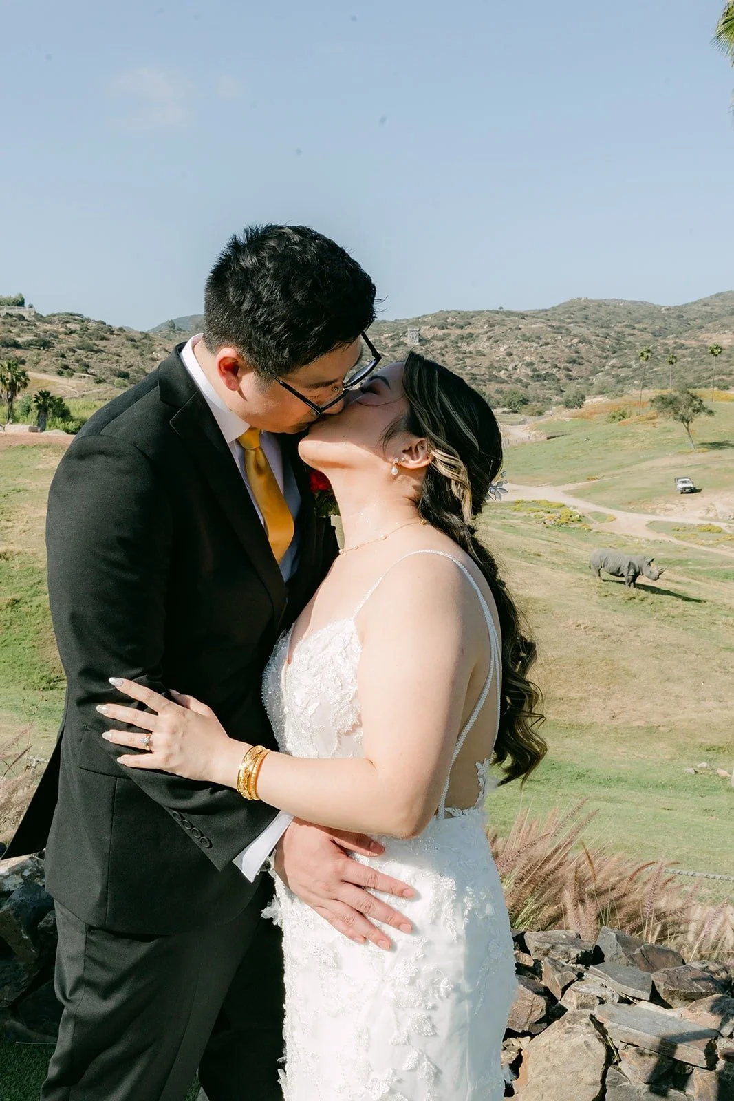 Joanne and Zach kissing in the afternoon sun at the Safari Park, photographed by One and Only Production