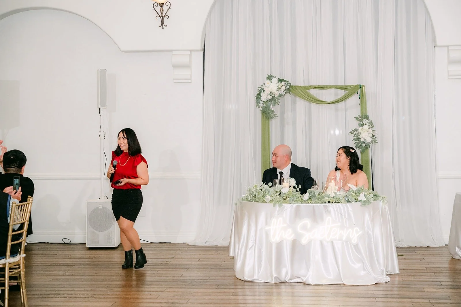 A bridesmaid giving her speech to the couple