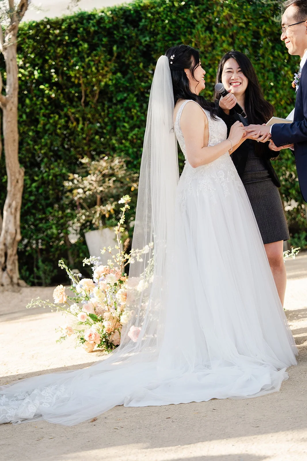 Couple holding hands at the front of the ceremony