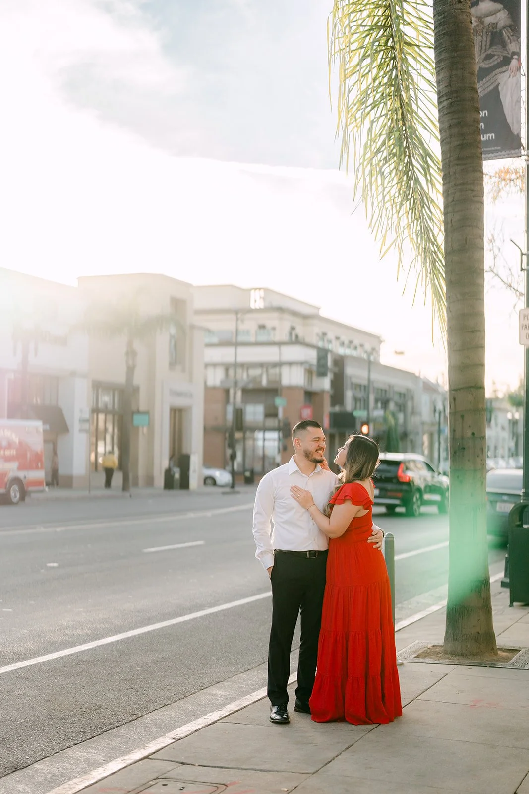 Linh and Ankush on a sunny sidewalk in Old Town Pasadena.