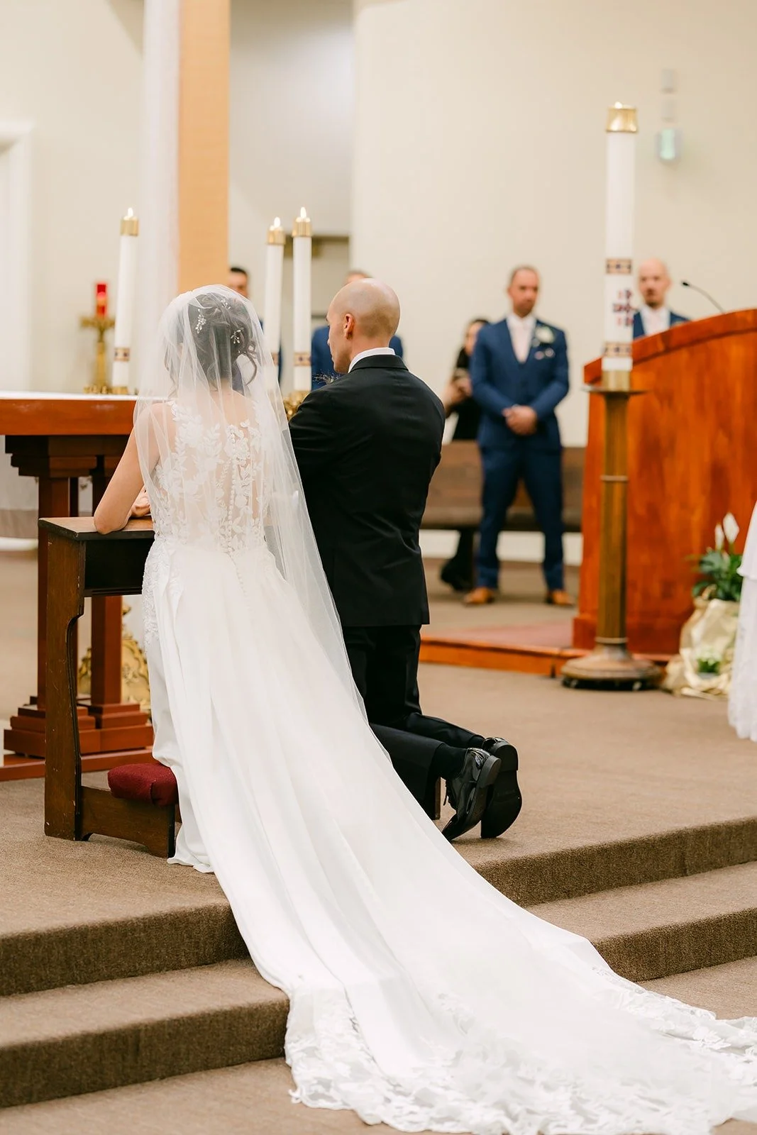 Francesca and Daniel kneel at the altar of Beatitudes of Our Lord