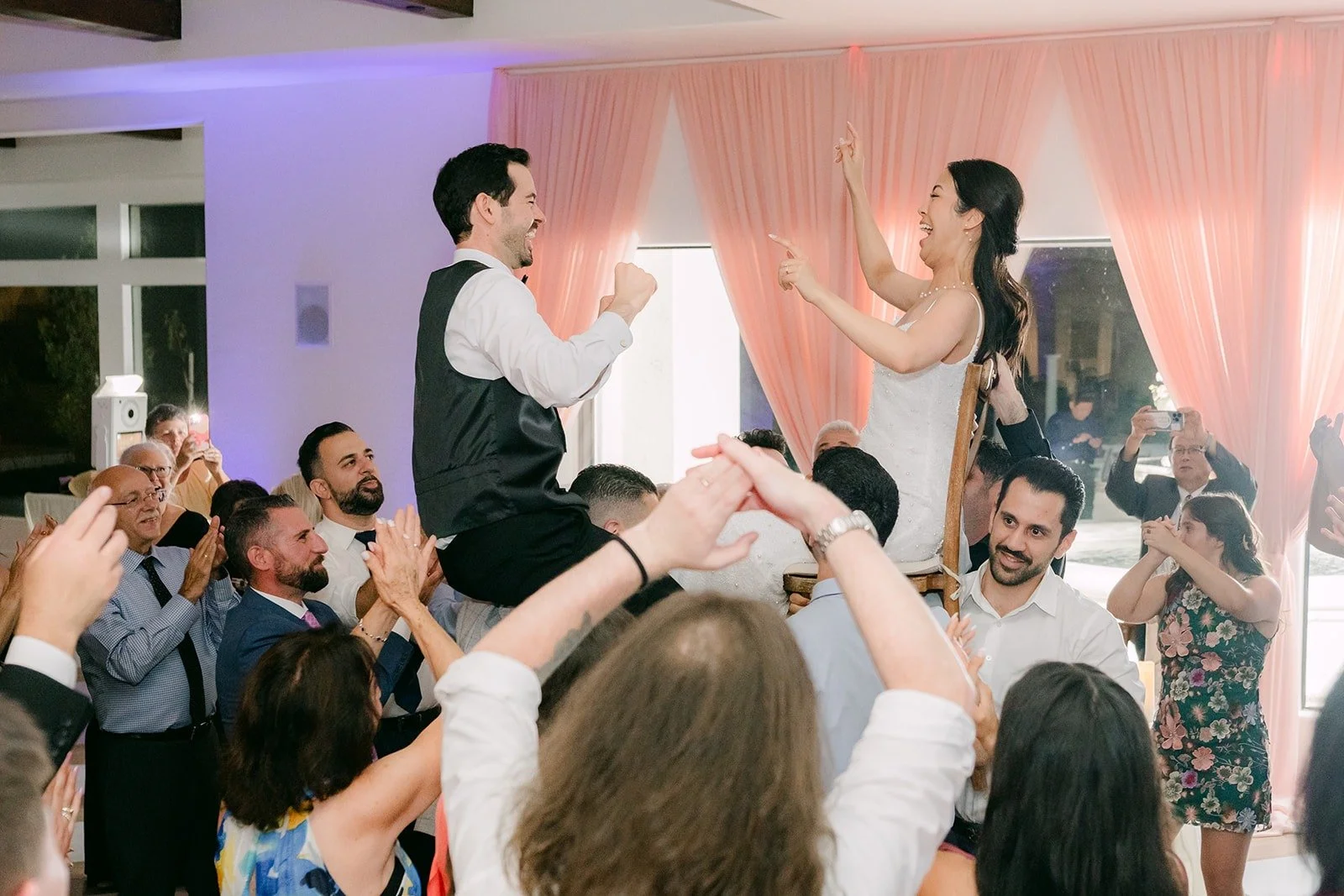 Stephanie and Kevin in the middle of a packed dance floor