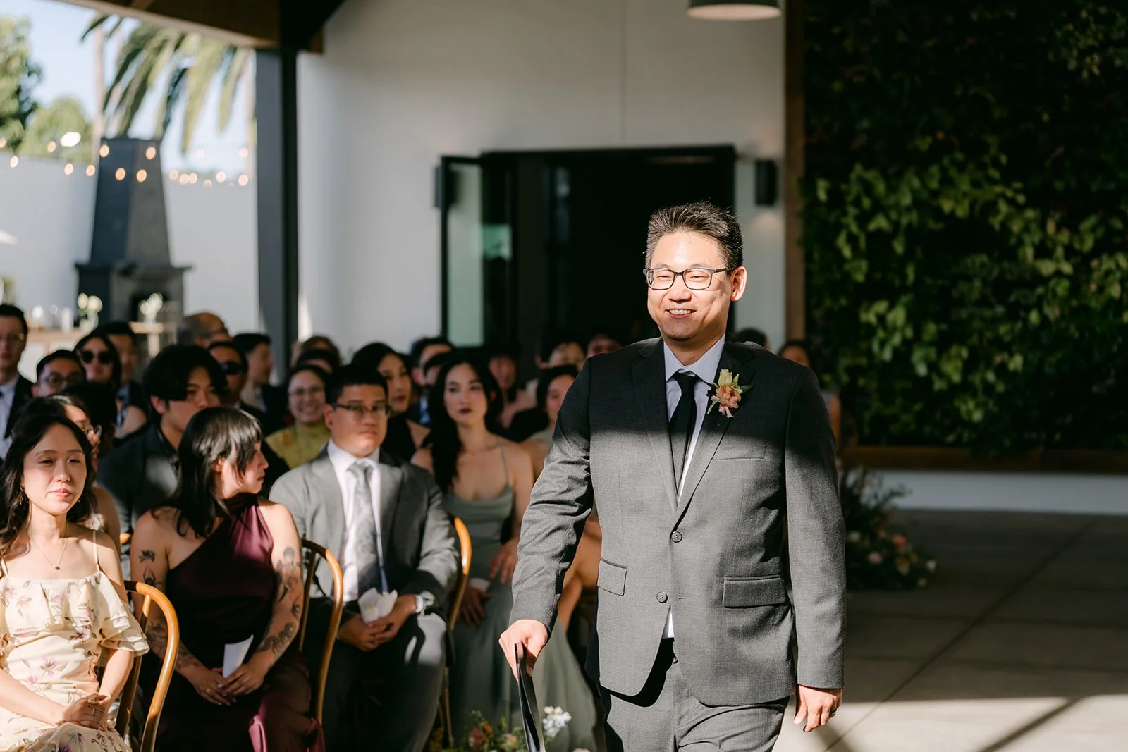 Groomsman walking into the ceremony