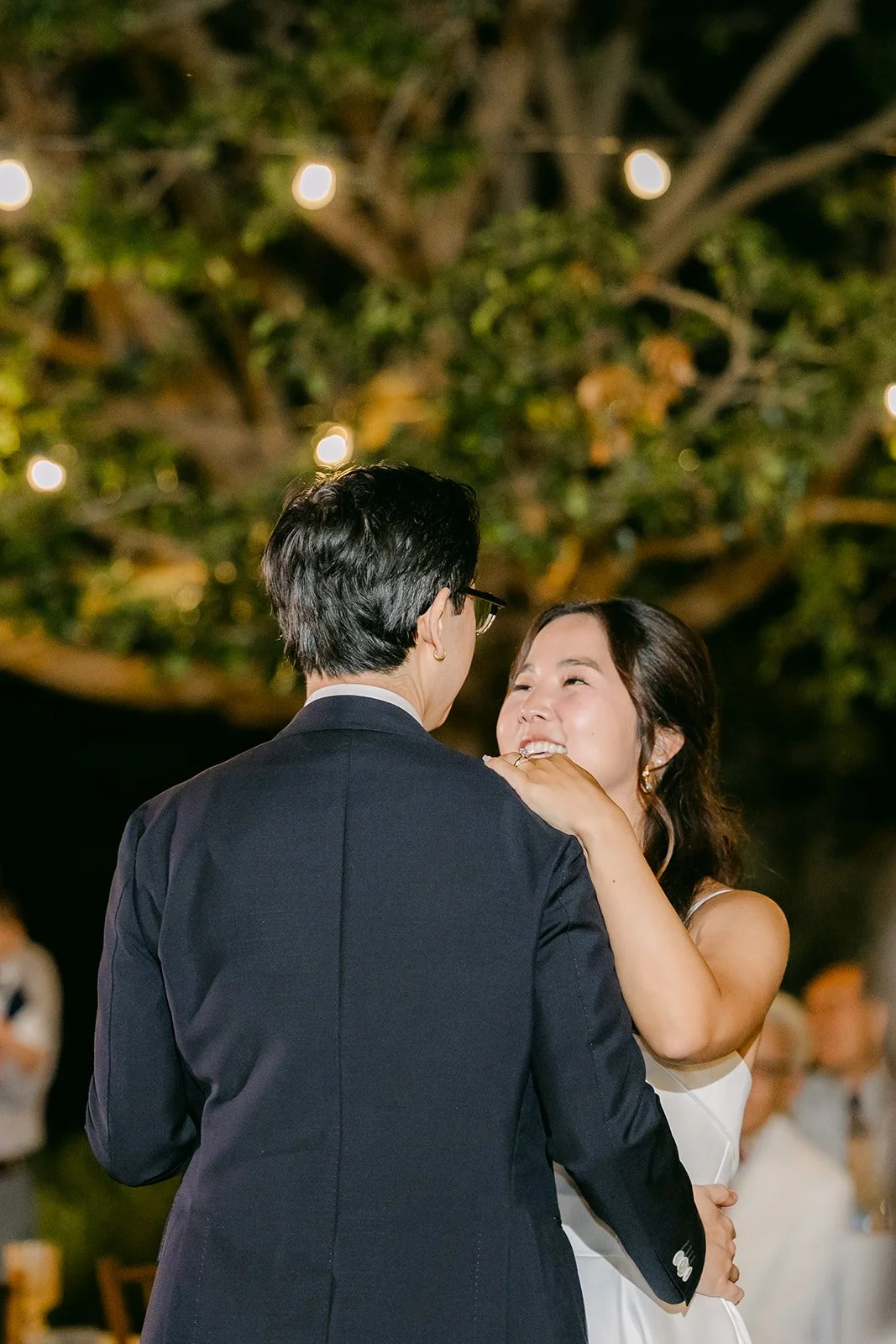 A nighttime slow dance under the trees