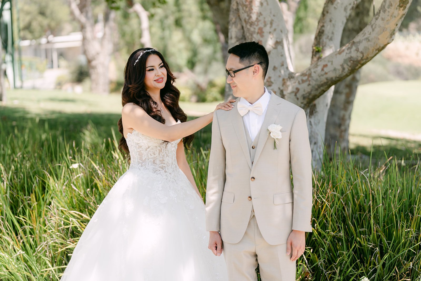 Sandra and Kevin smiling at each other during their first look at Coyote Hills.