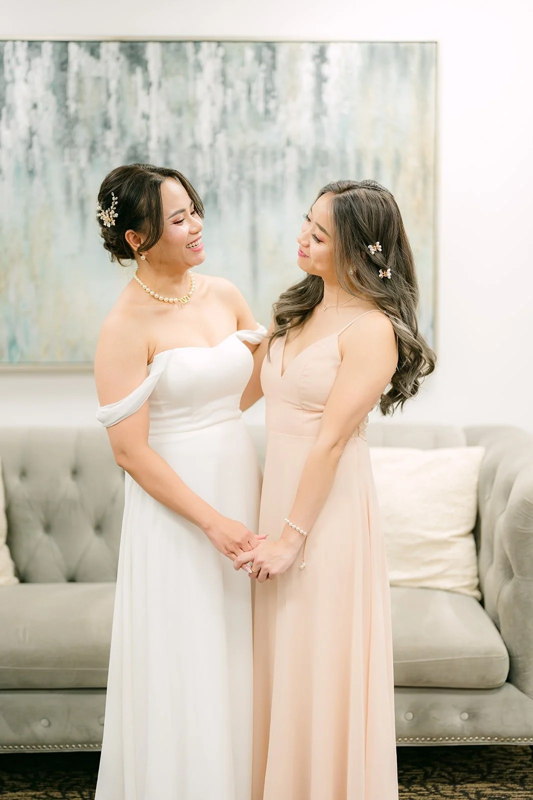 Ivy and Linh side by side in the bridal suite