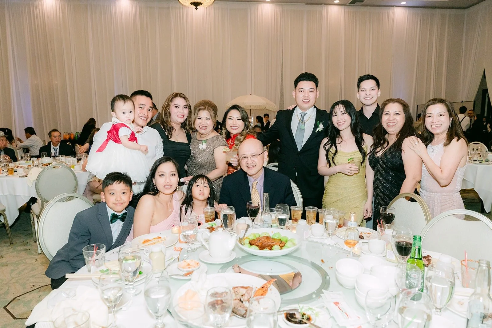 A full table cheering with Candice and Vincent