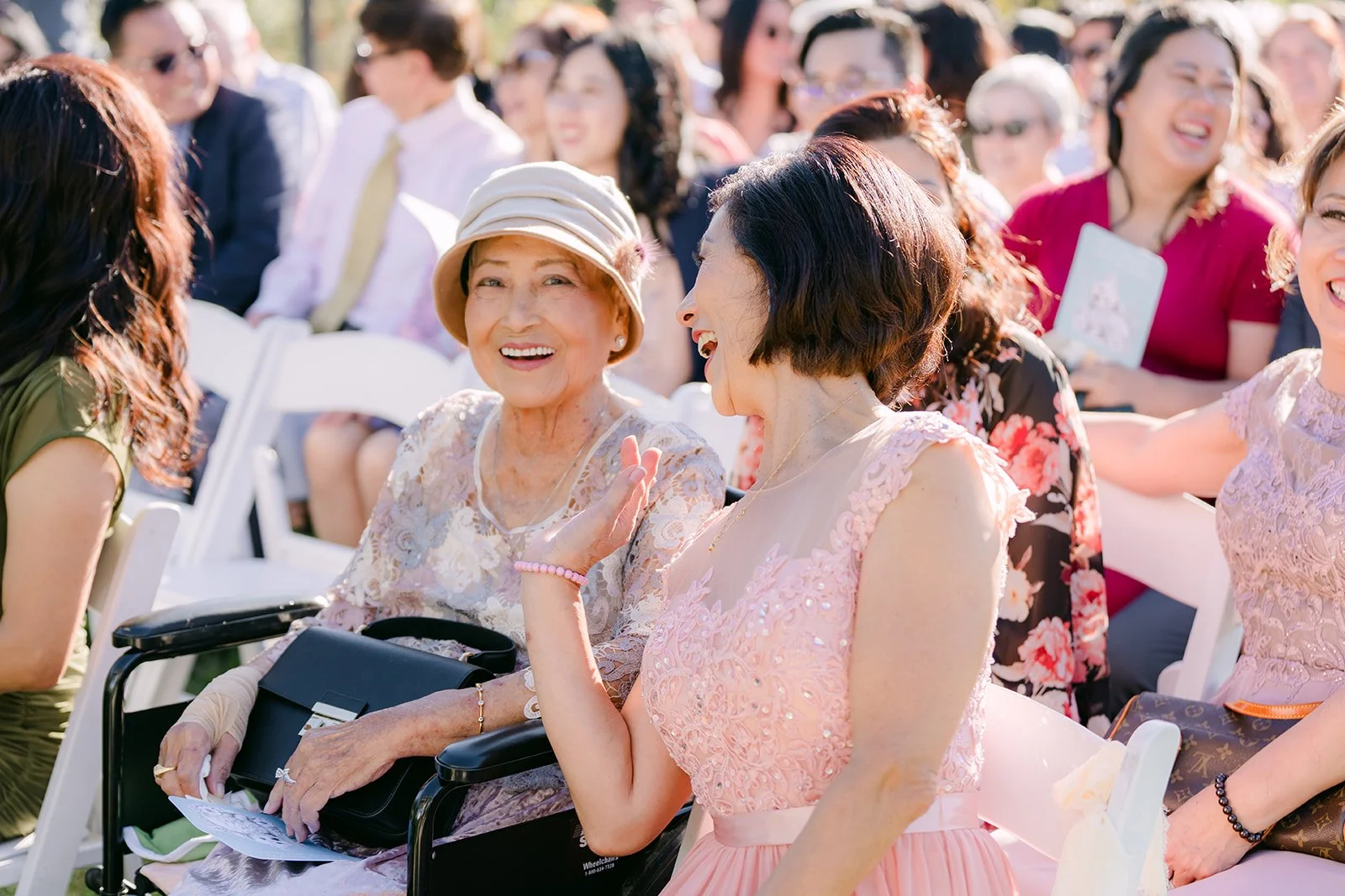Guests sharing a laugh while waiting for the processional