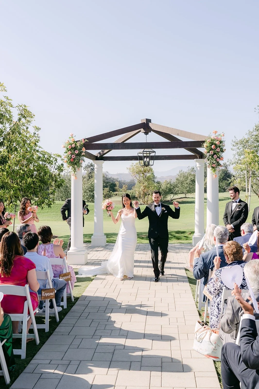 A wide view down the aisle to the pagoda during the ceremony