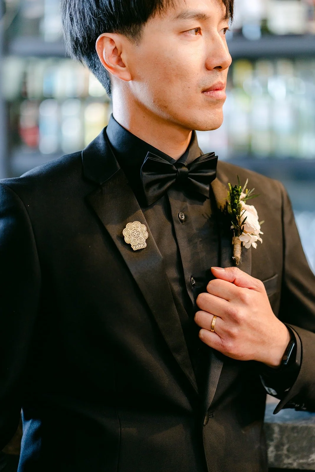 Fong pinning his white boutonniere