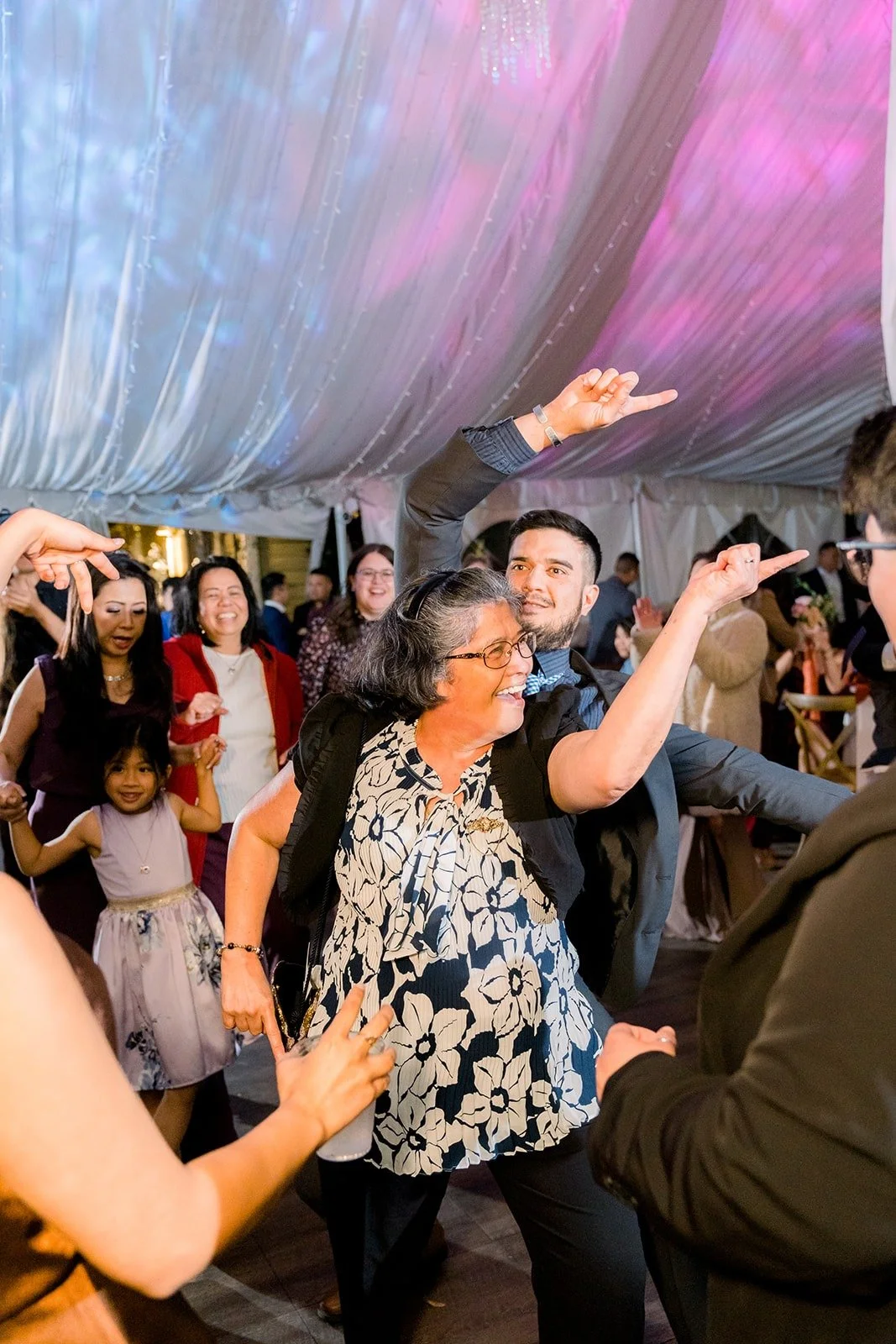 Guests dancing under the colored lights