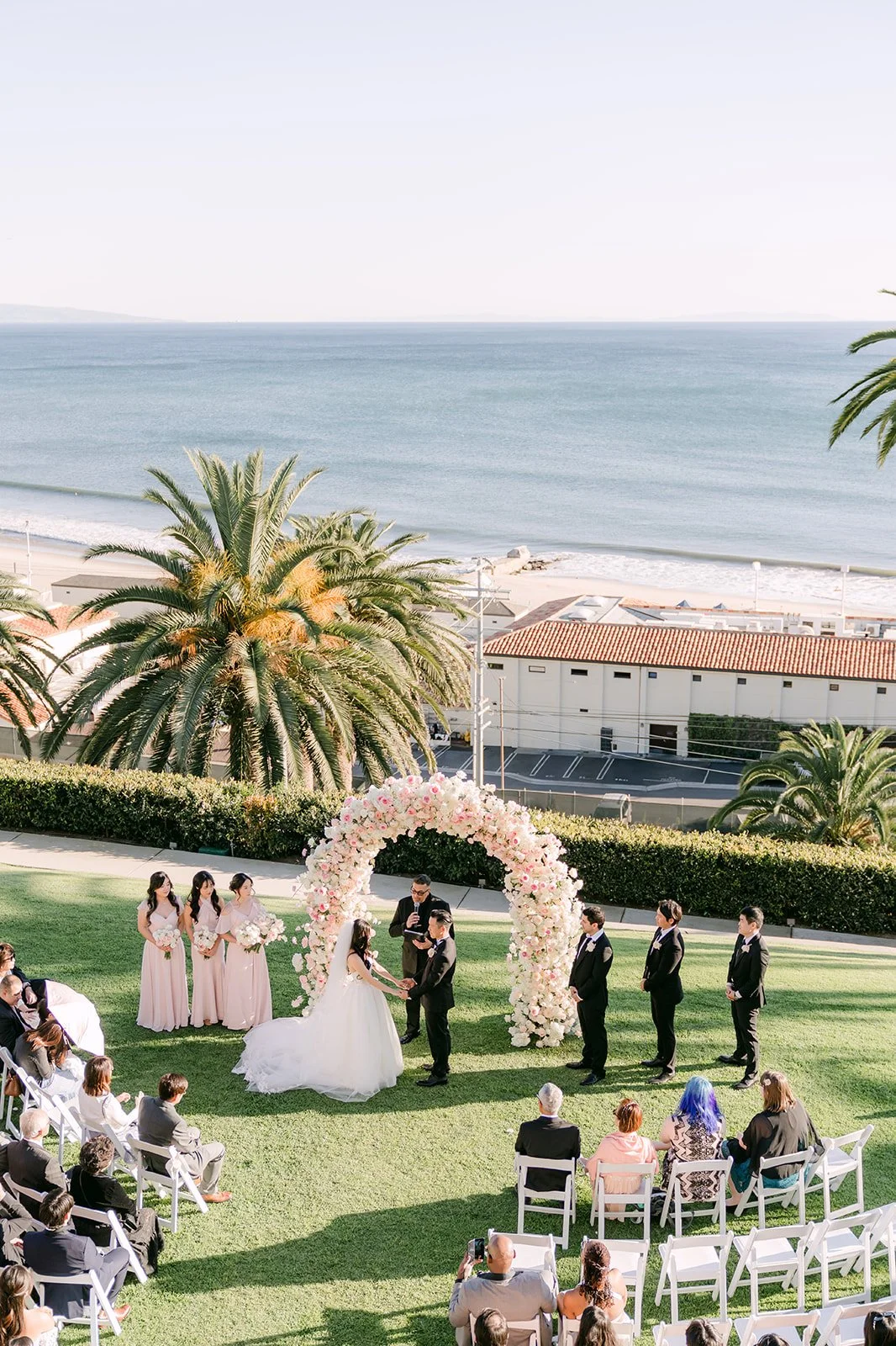 Oceanfront lawn ceremony at Bel-Air Bay Club with guests seated