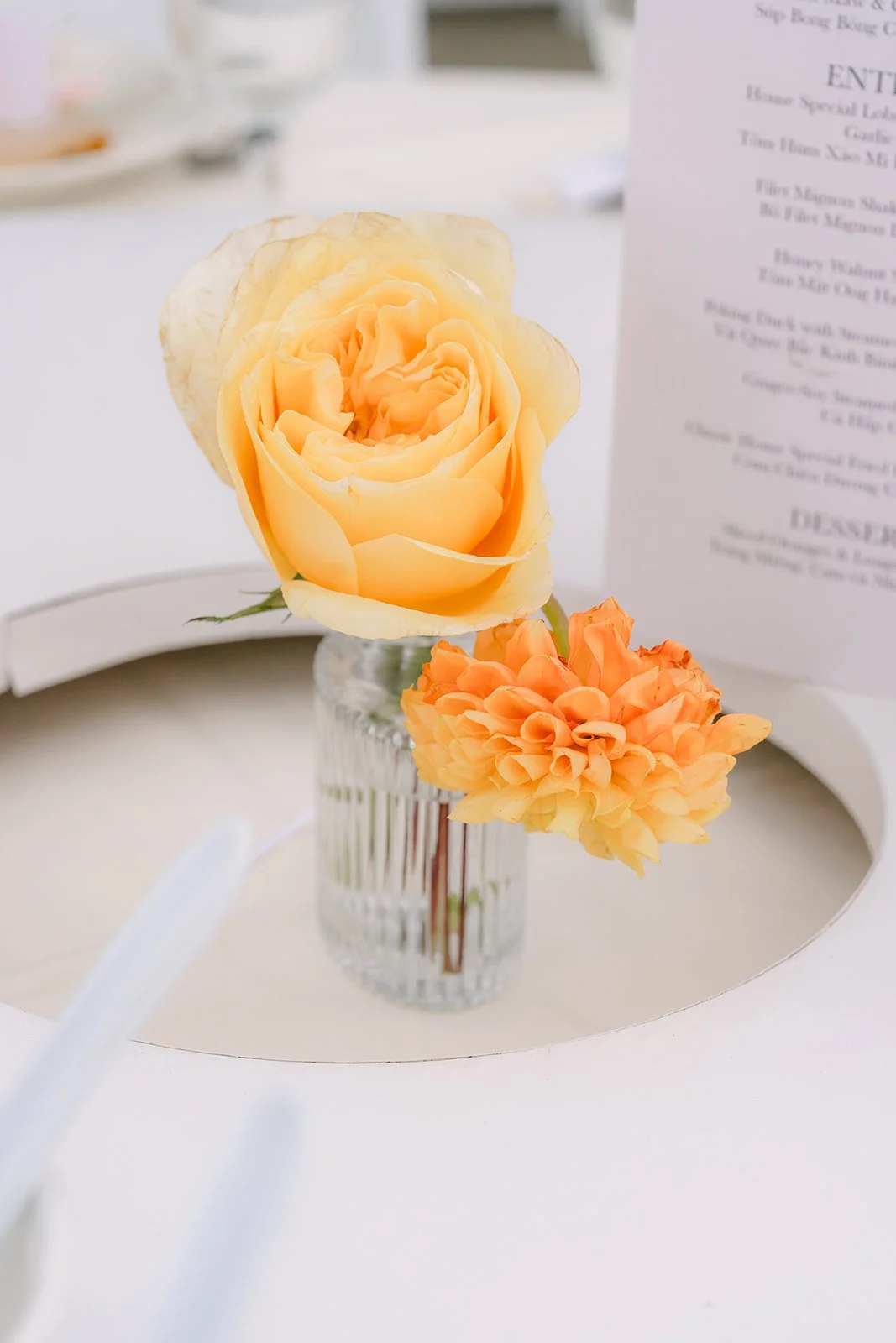 Peach rose and menu at each place setting