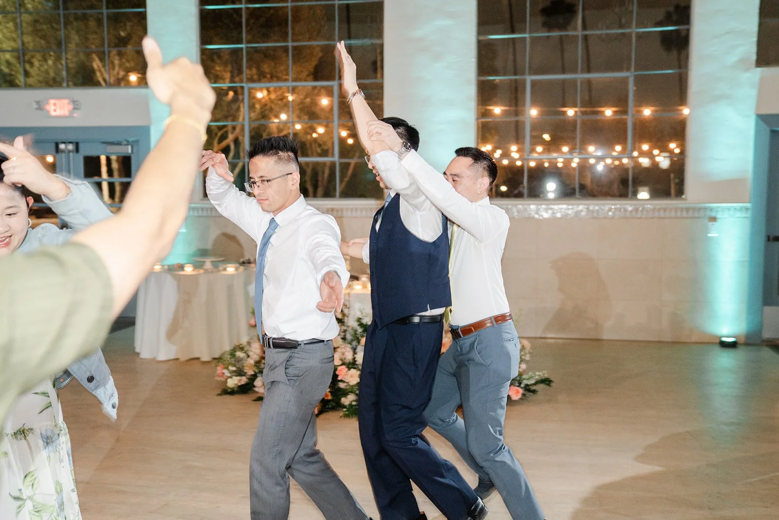 Guests dancing with arms in the air