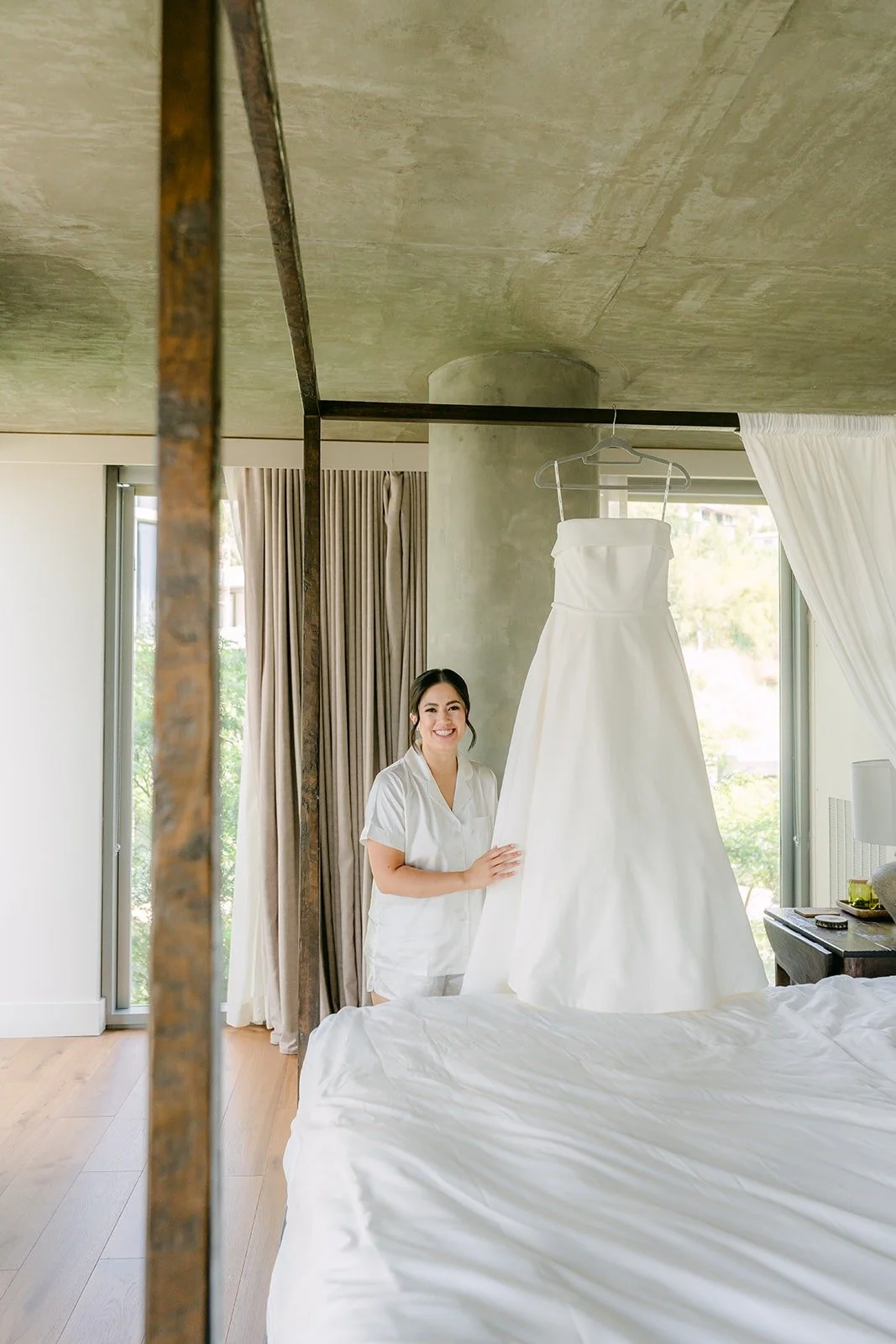 Brianna in her robe next to her gown in the suite at 1 Hotel West Hollywood