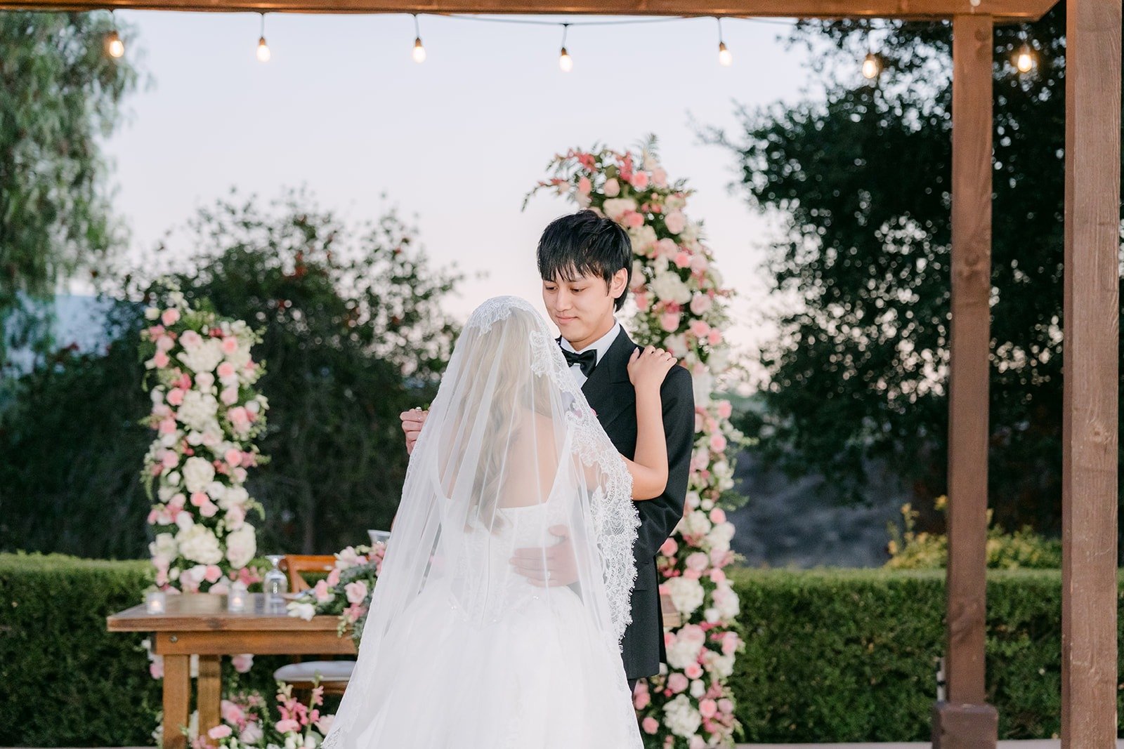 Konitha and Job sharing their first dance under the pergola