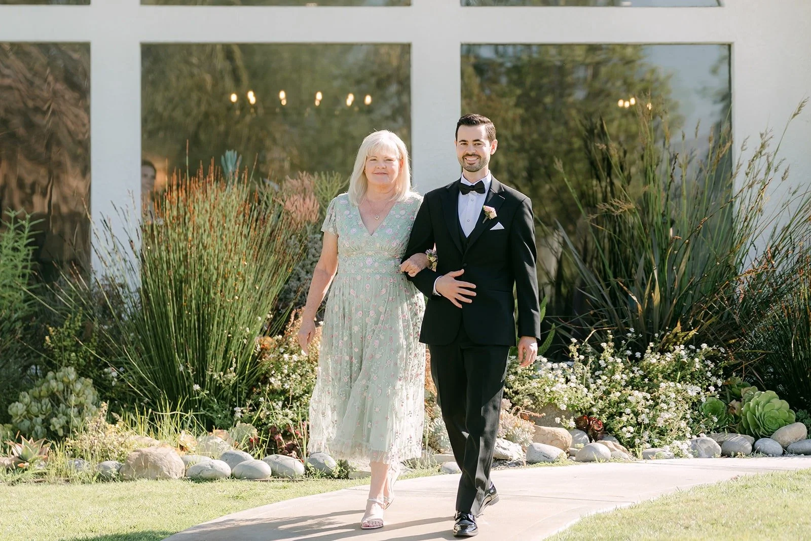 Kevin walking down the aisle with his mom