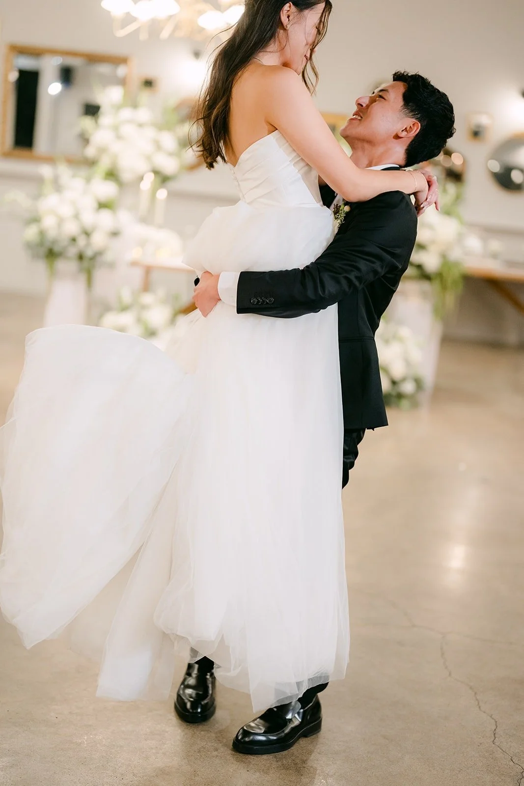Richard lifting Jadee at the end of their first dance, photographed by One and Only Production