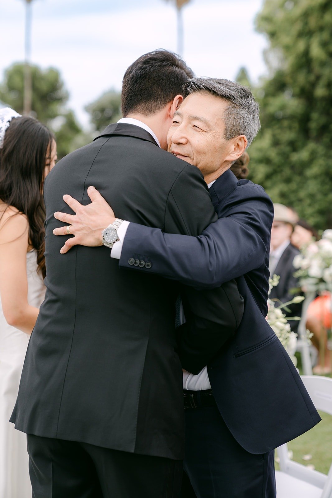 William sharing a hug with a family member after the ceremony