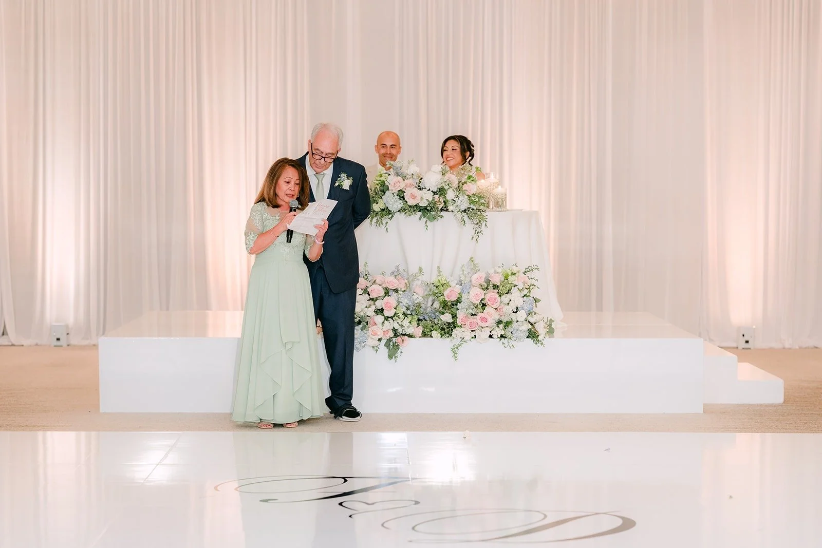A family member speaks as Francesca and Daniel listen