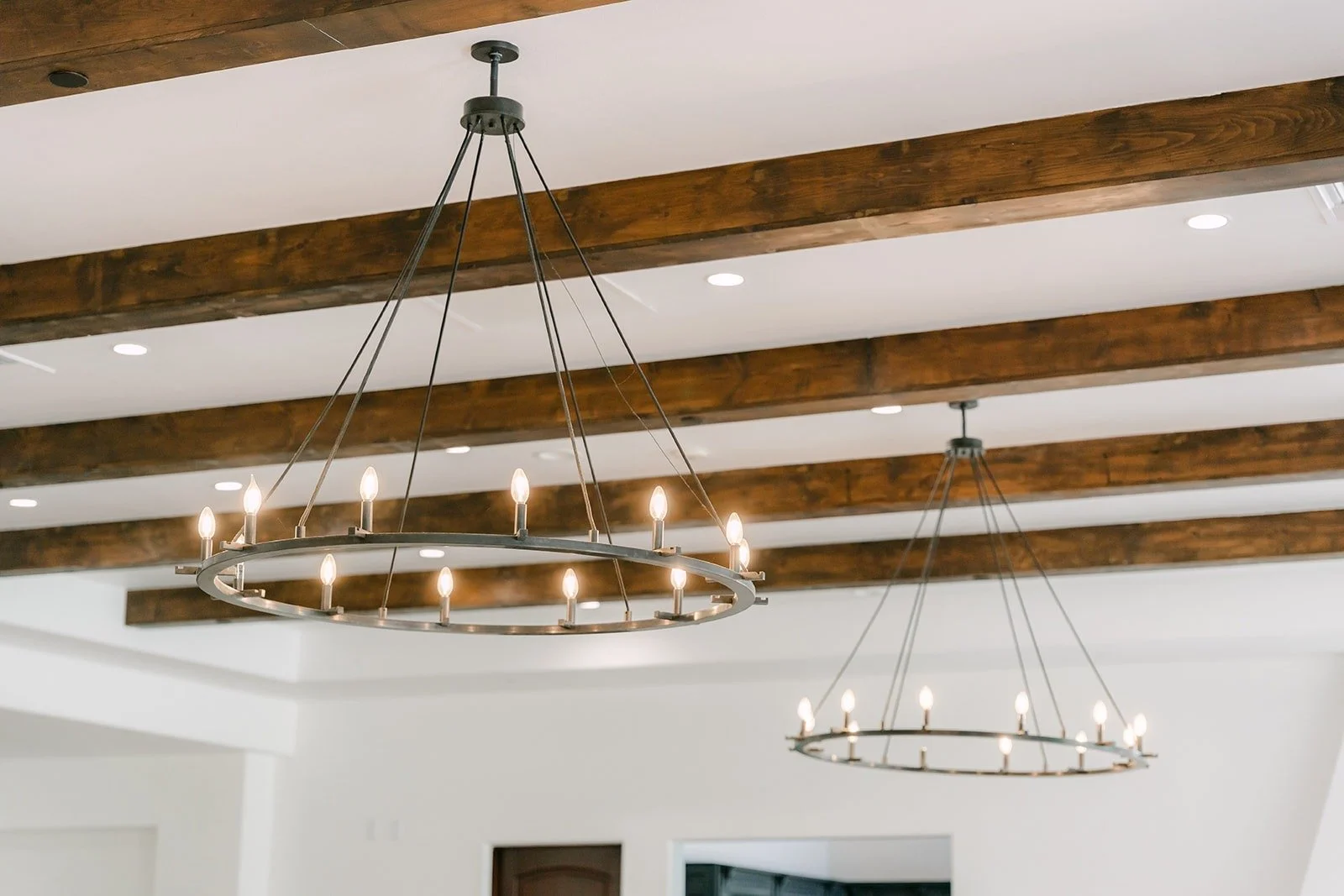 Wood beams and iron chandeliers on the reception room ceiling