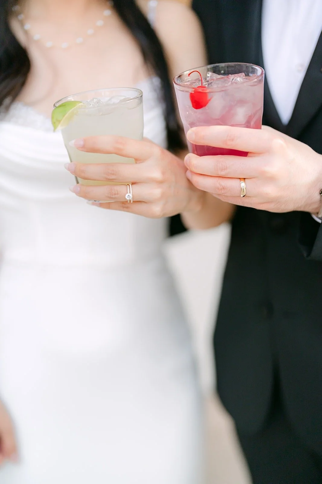 Stephanie and Kevin toasting with cocktails during cocktail hour