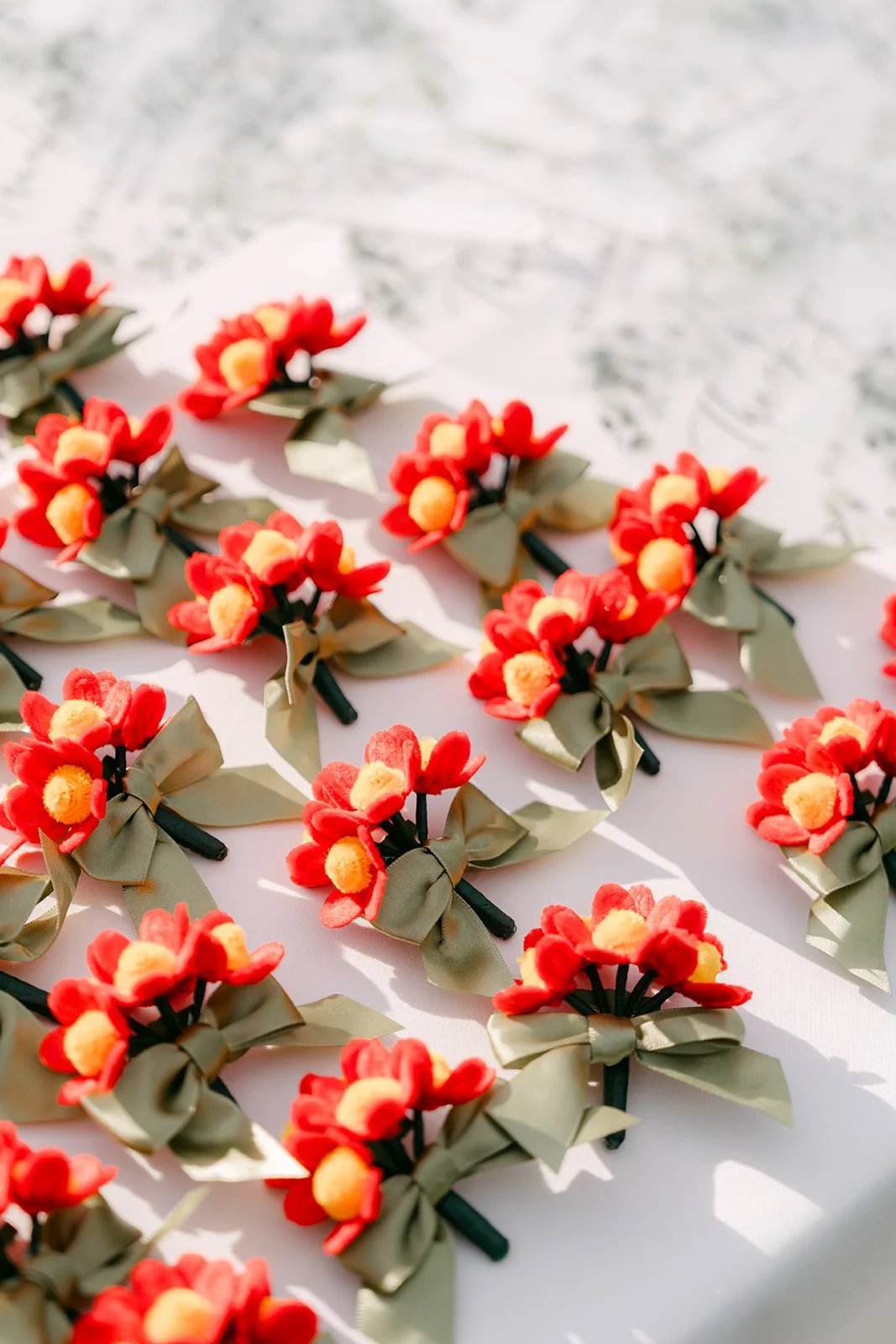 Handmade red paper flowers that Elaine made herself.