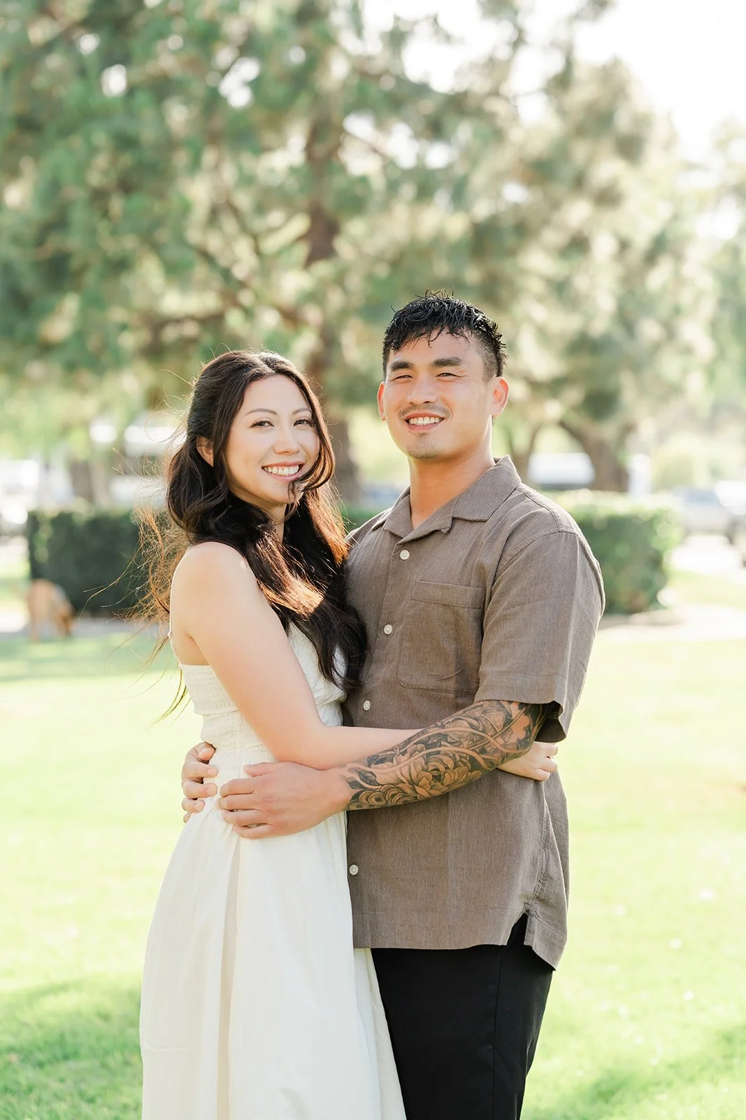 Victoria and Andrew stand together on the lawn near Malaga Cove Plaza.