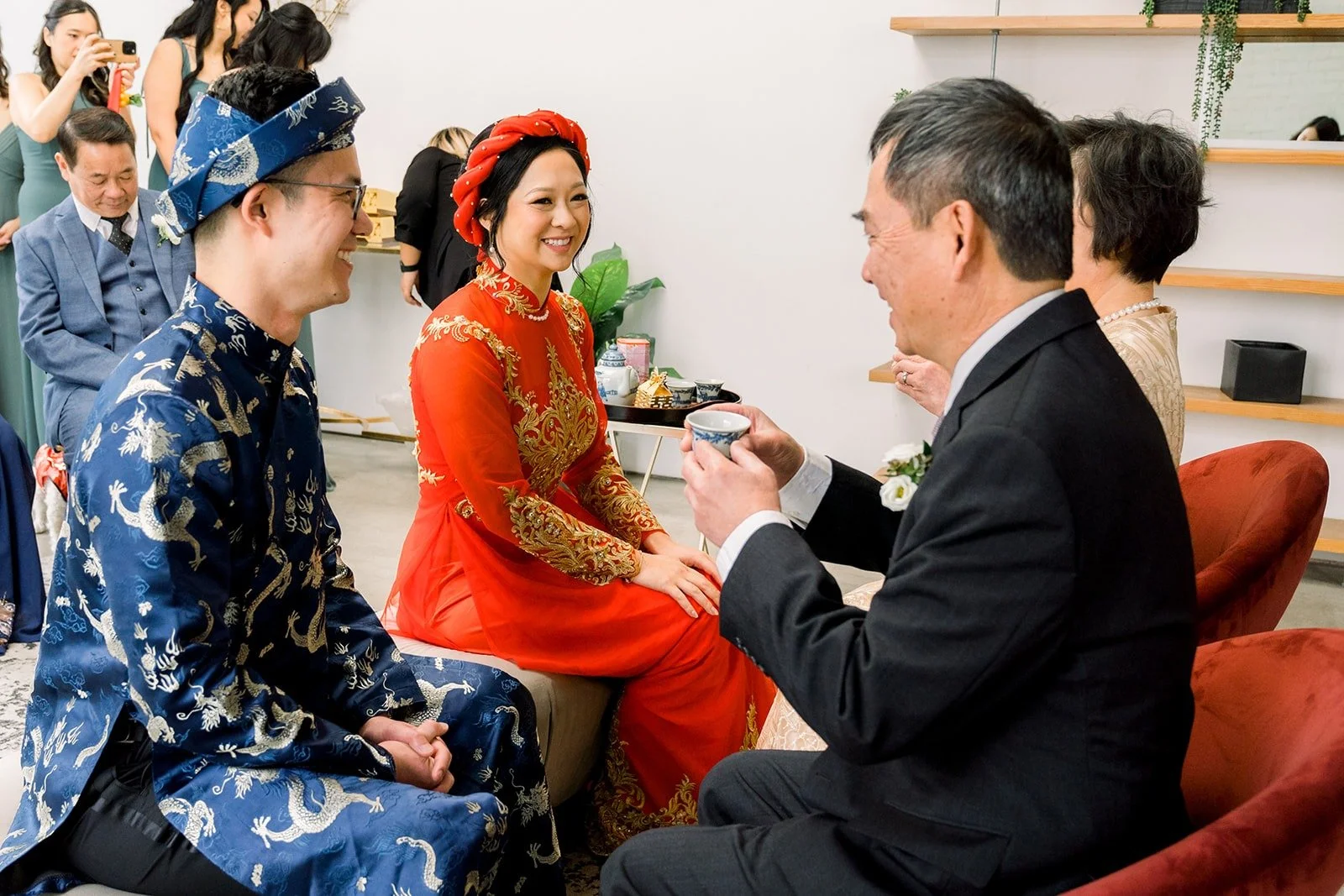 Cindy and Alex serve tea to family members