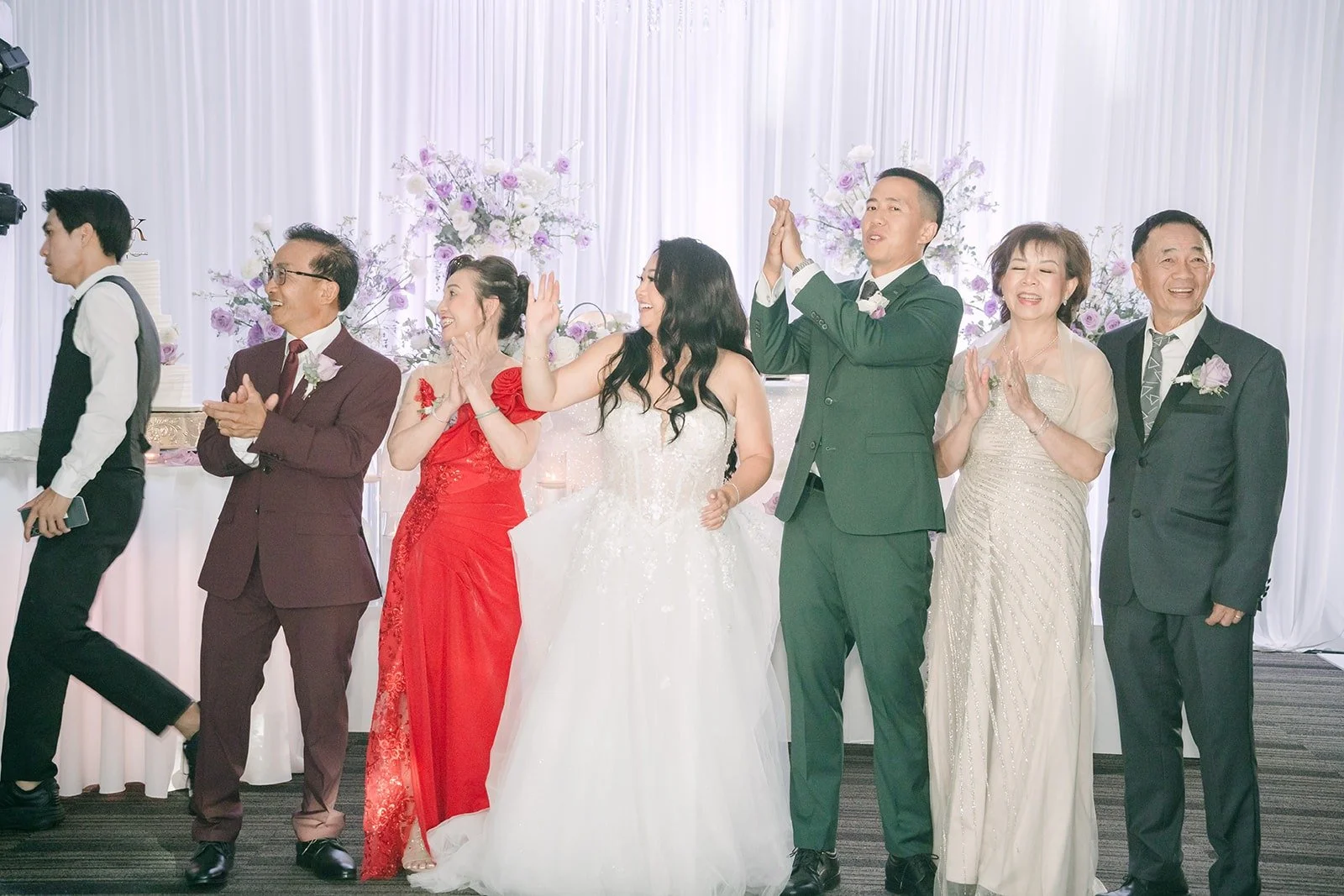 Family members raise a toast on the dance floor with Jennifer and Kevin