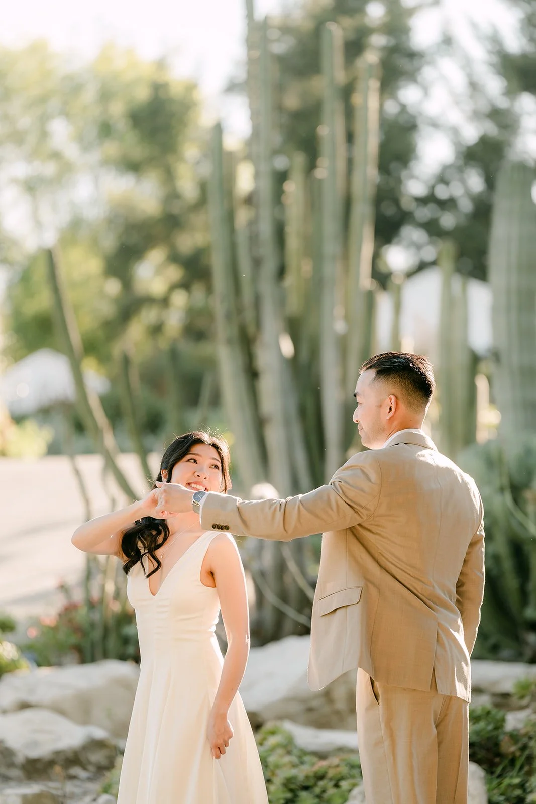 Vincent twirls Kim on the path through the cactus garden, photographed by One and Only Production.