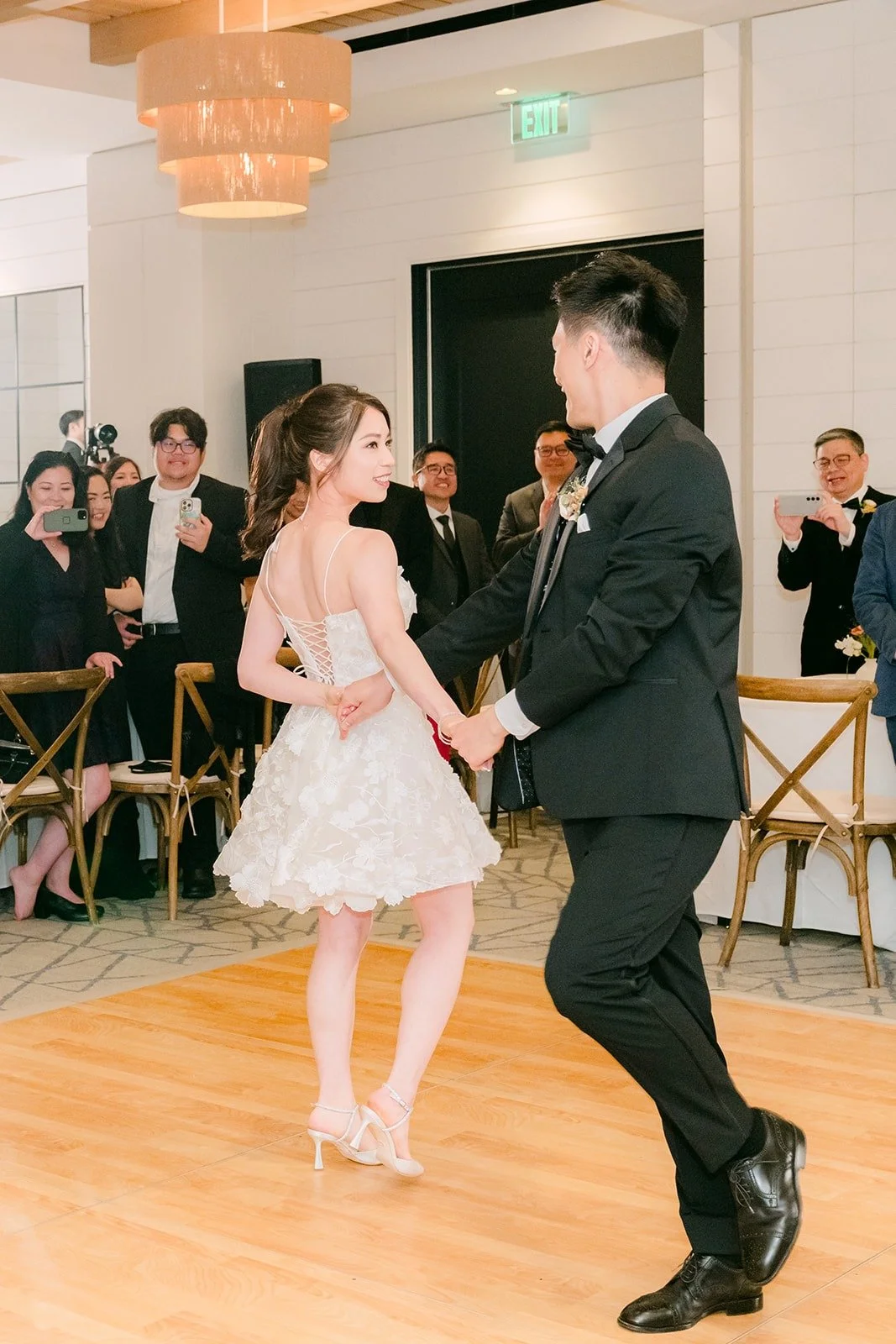 Angela and Eli finishing their first dance with a flourish
