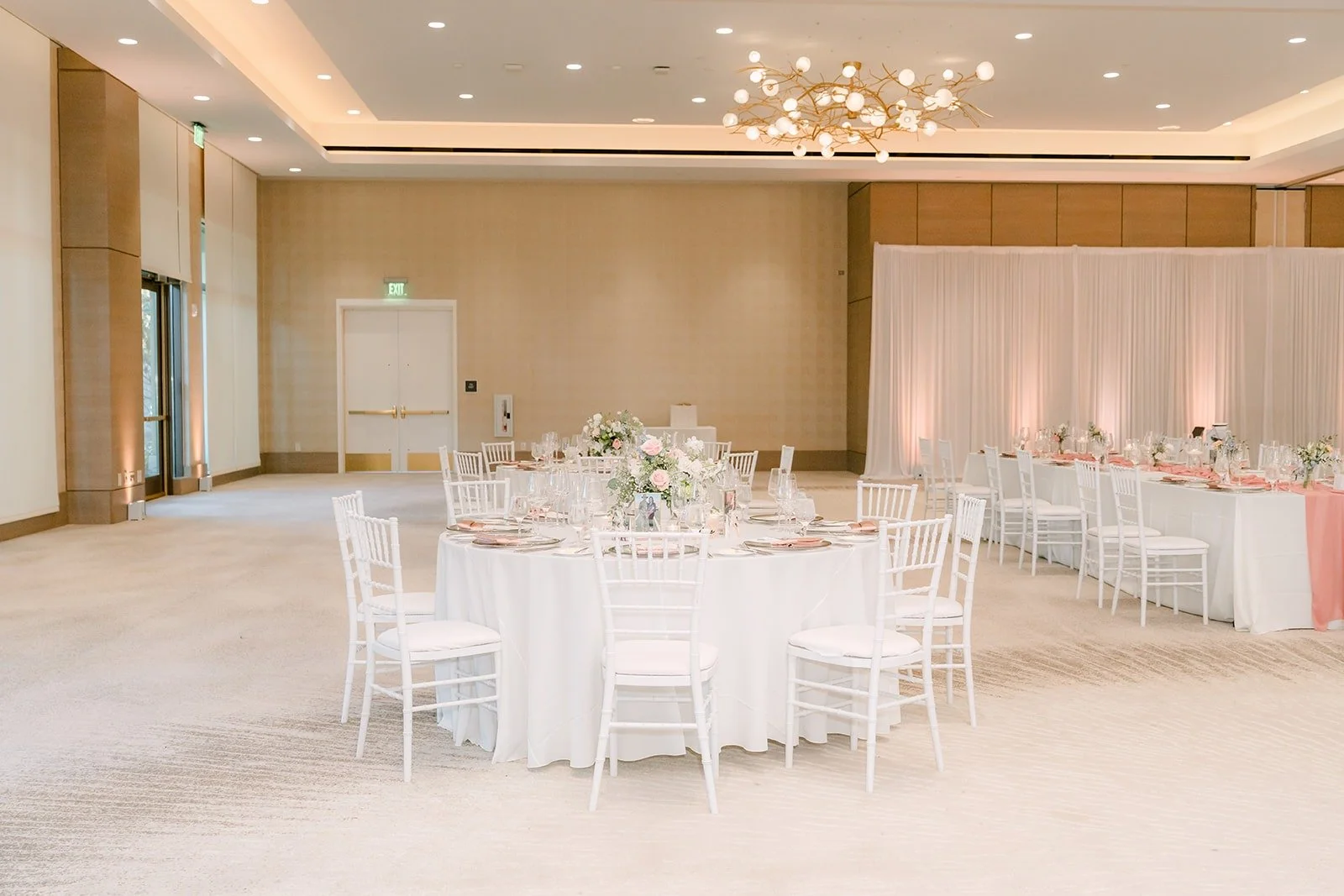 The Carousel Ballroom at The Westin Anaheim Resort set with round tables and white chairs