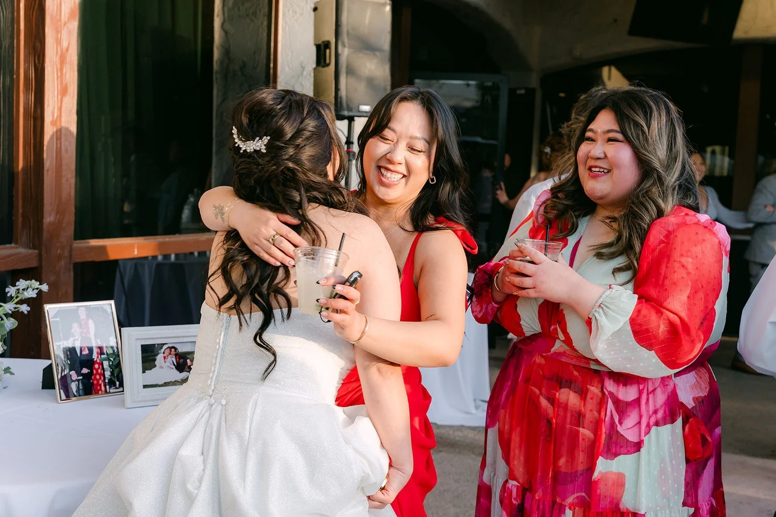 Florence hugging guests during cocktail hour