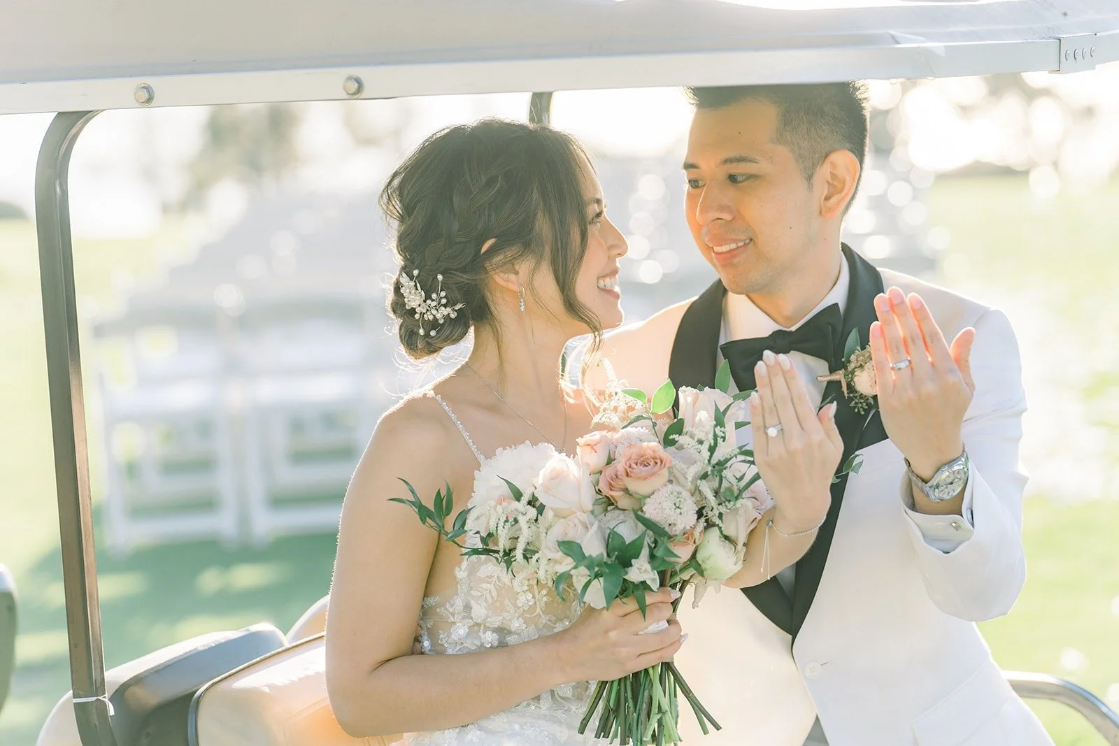 Josephine and David riding in a golf cart with her bouquet