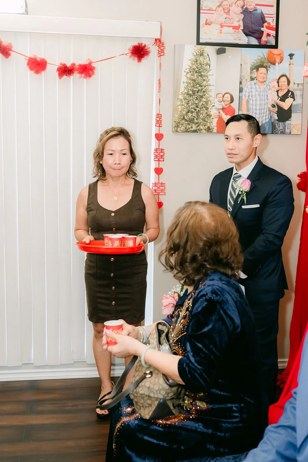 A relative accepting tea from the couple.