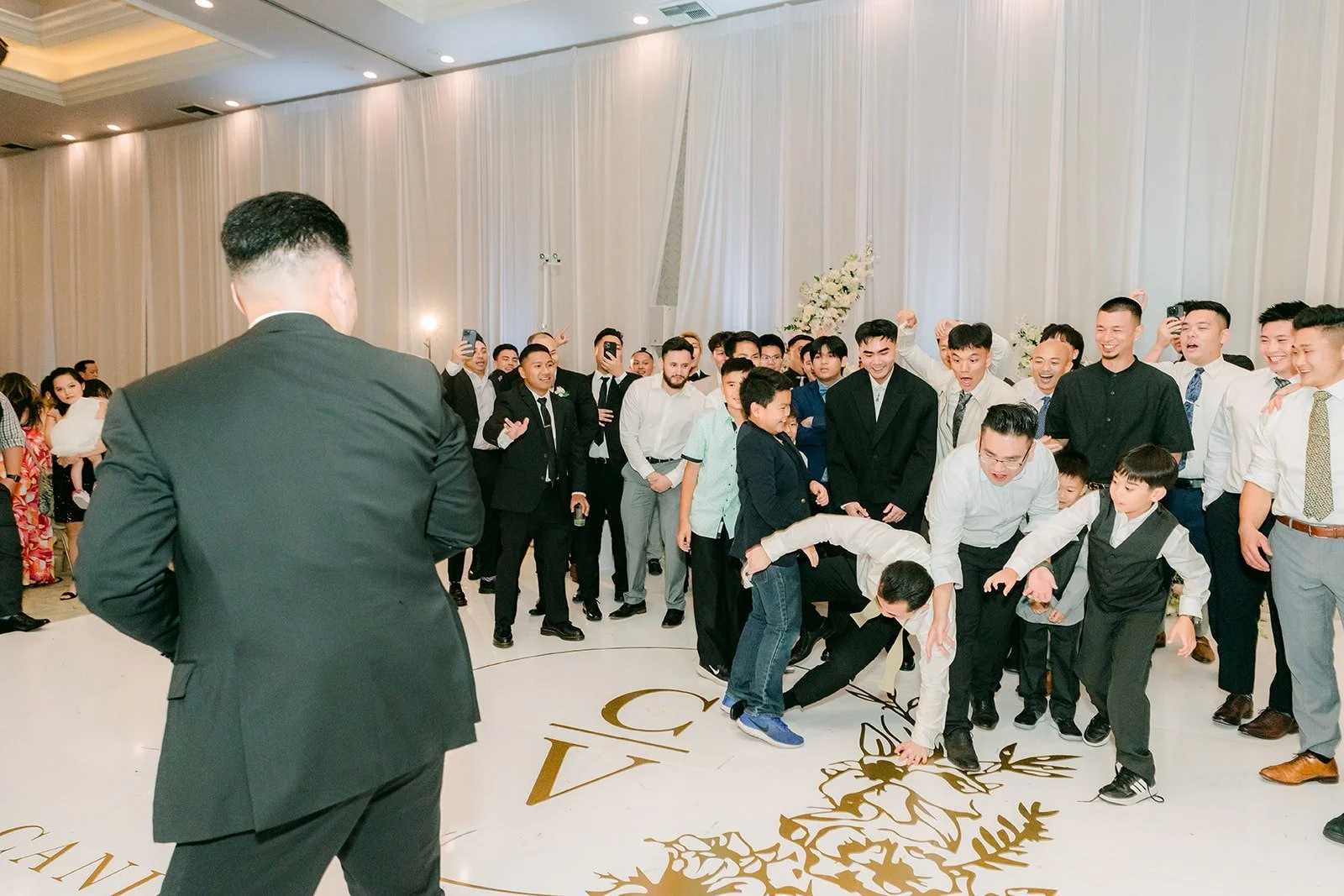 Groomsmen scrambling for the garter