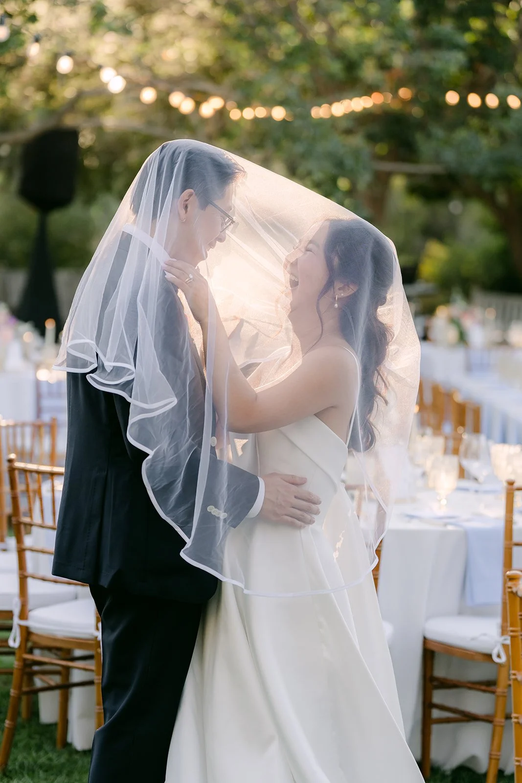 Under the veil together among the string lights