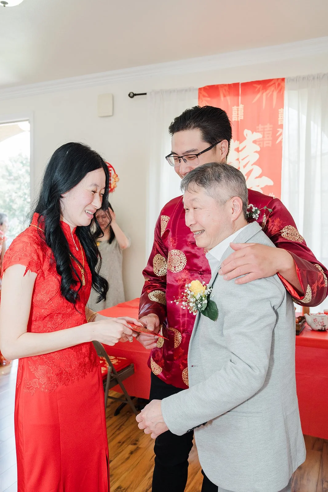 An elder placing a gift on Valerie.