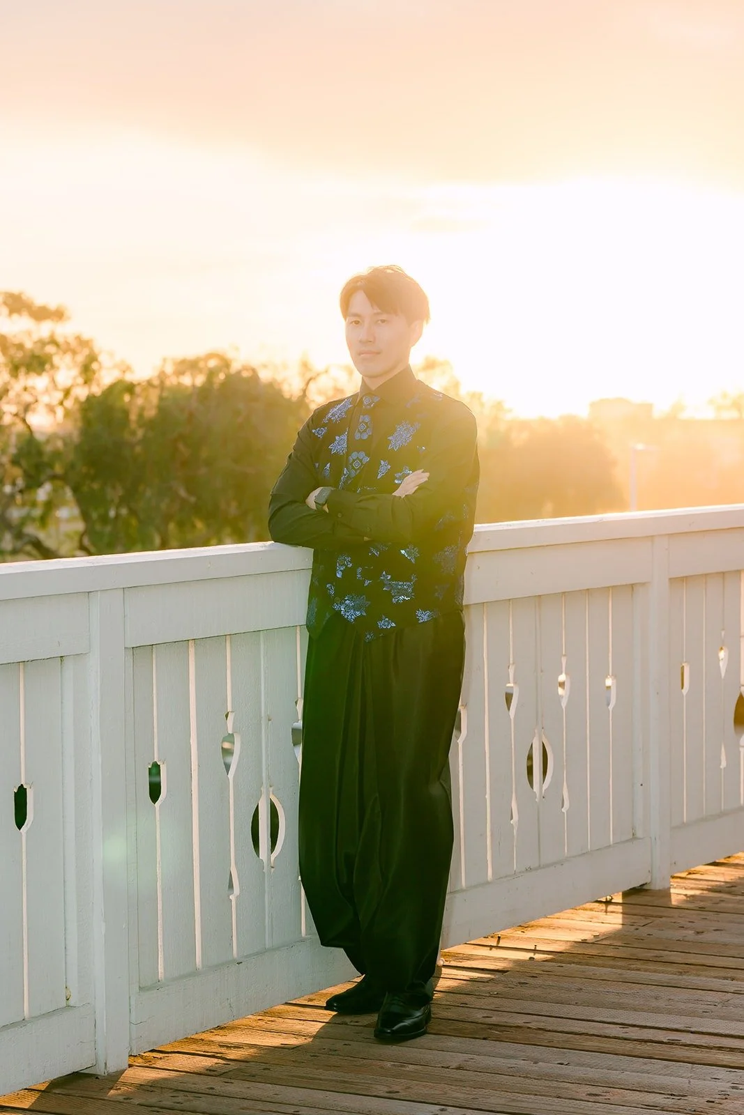 Fong in his black embroidered jacket in the golden light
