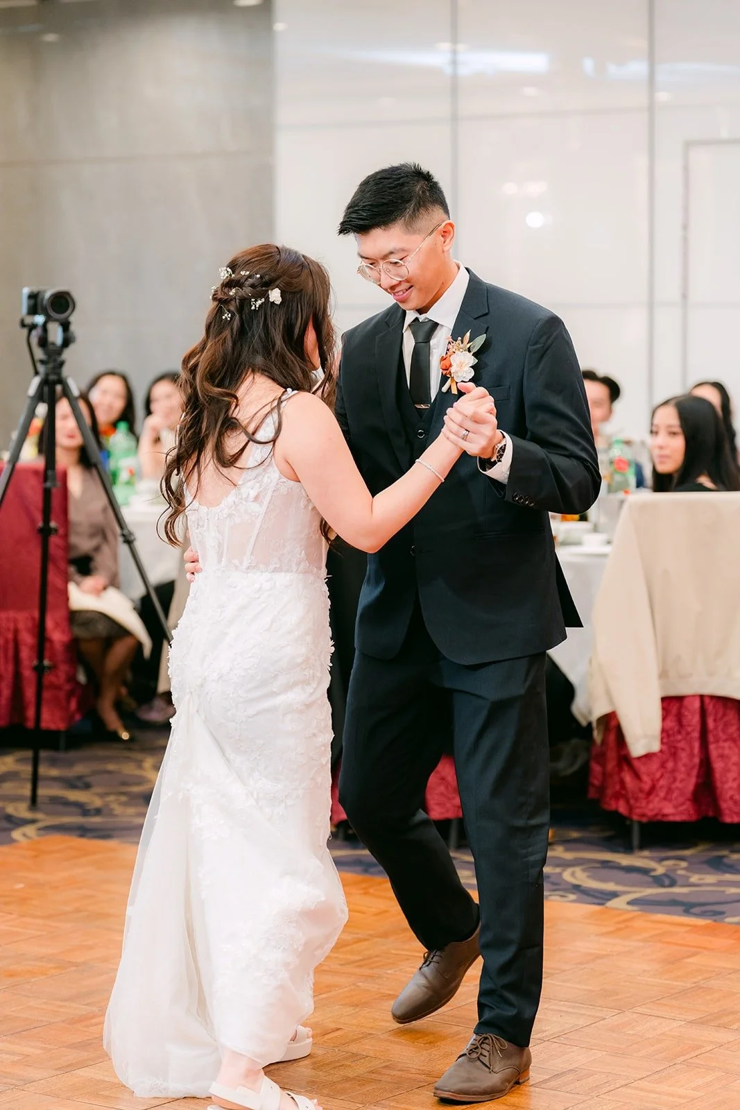 Shayna and Robert smile through their first dance