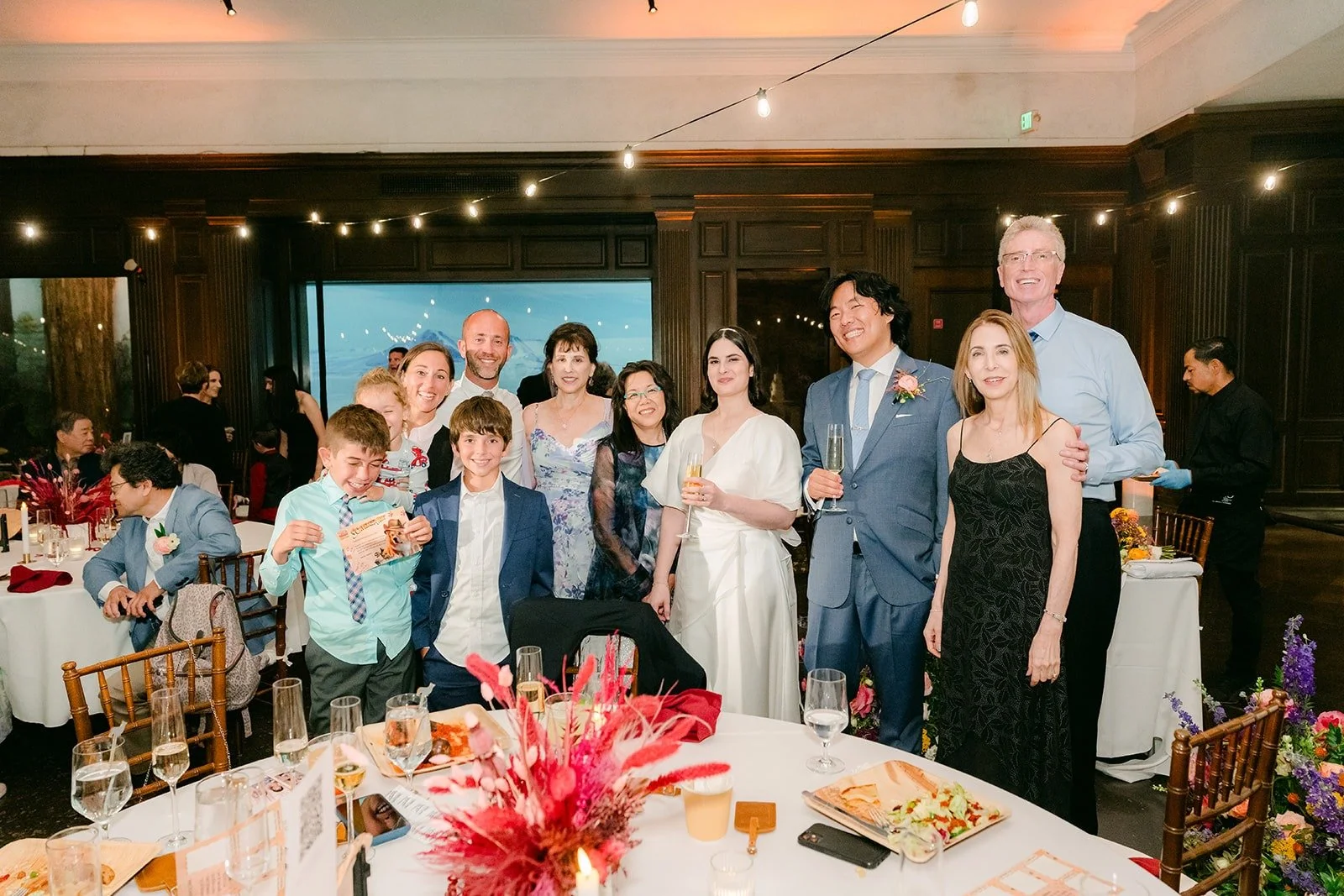 Jessie and Philip greeting guests at a table