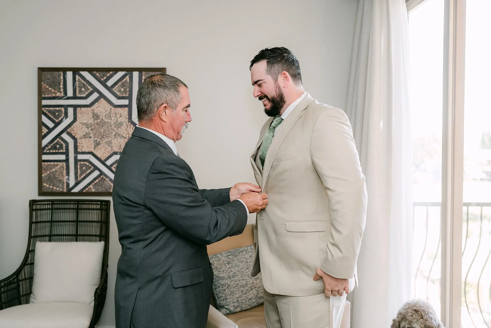 A family member adjusting Cody's jacket.