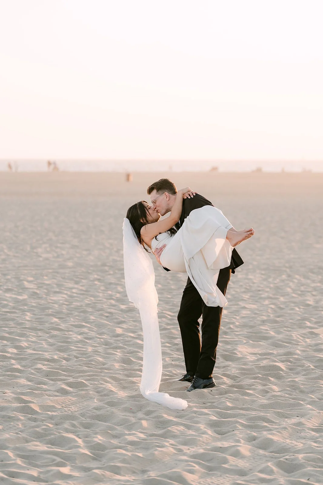 Matthew carrying Justine at sunset