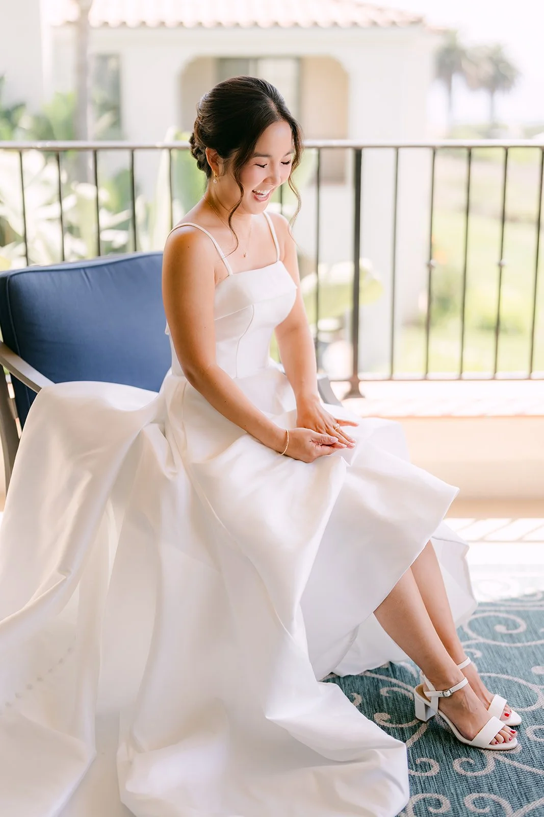Saya seated in the window light in her gown