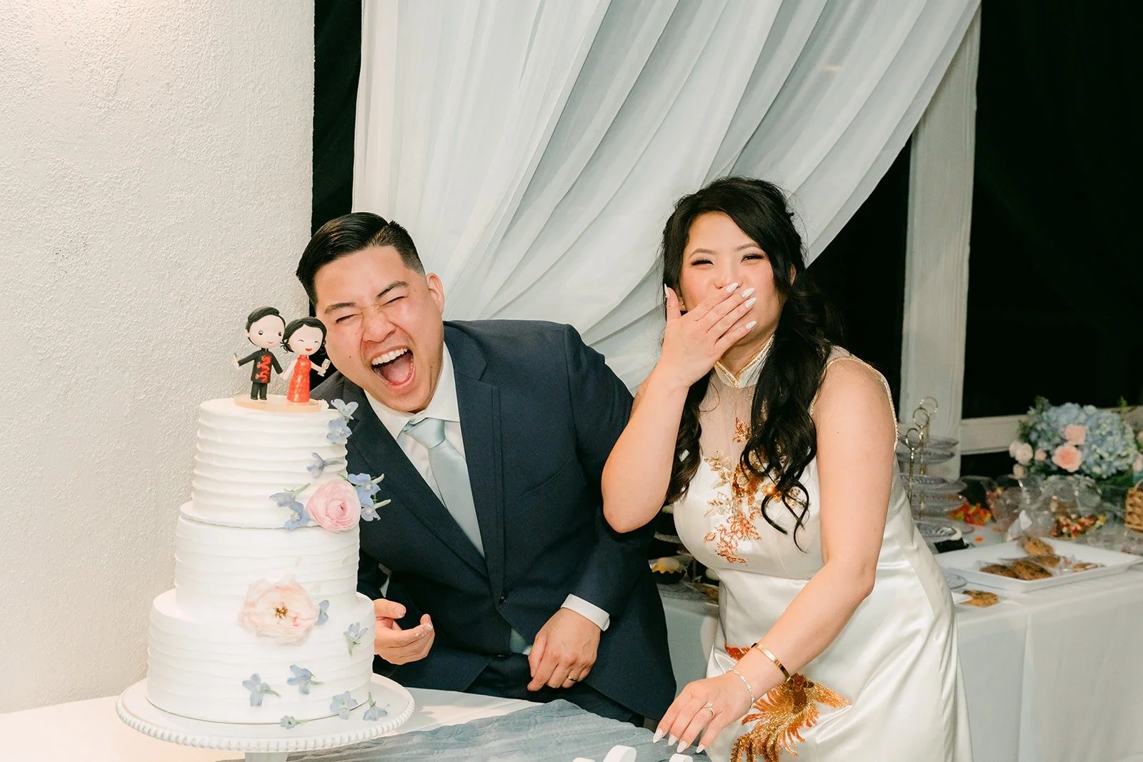 Jordan laughing after a bite of cake