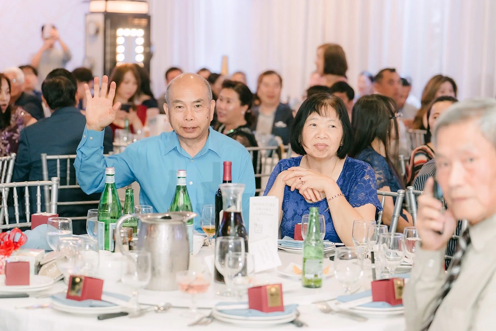 Family members laughing during the toasts