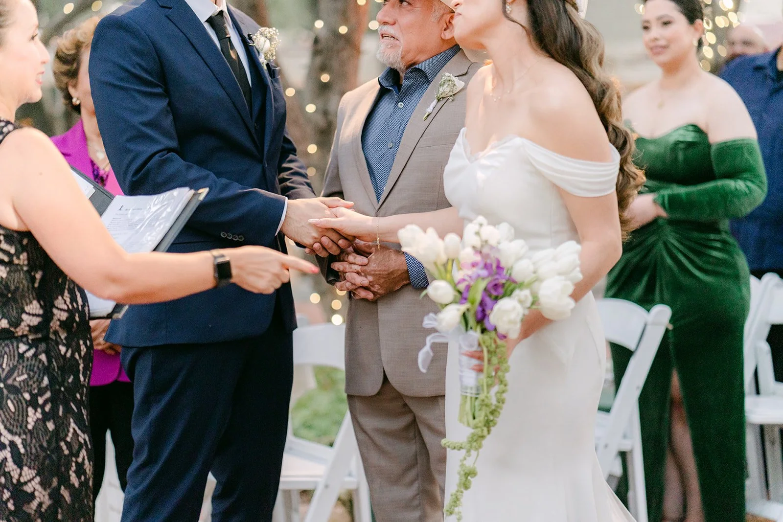 Mariana's dad placing her hand in Danny's