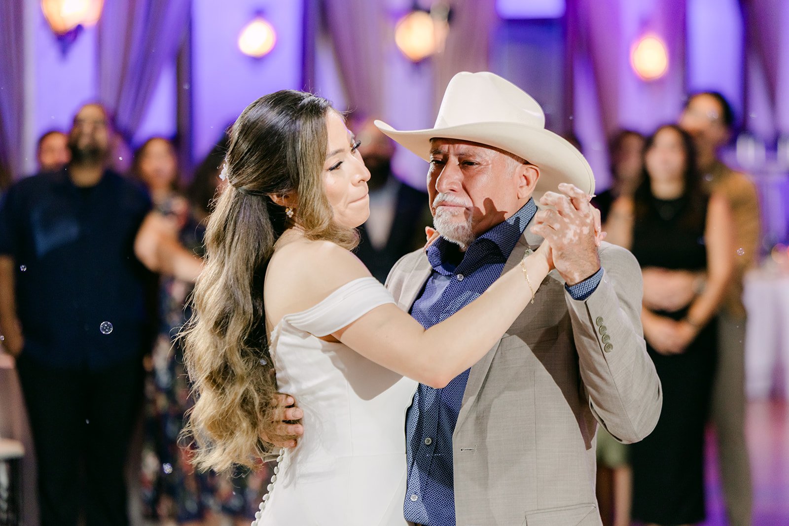 Mariana and her dad laughing during the father daughter dance
